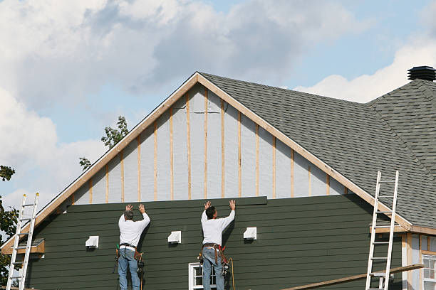 Professional Storm Damage Siding Repair technician working in Streamwood, IL